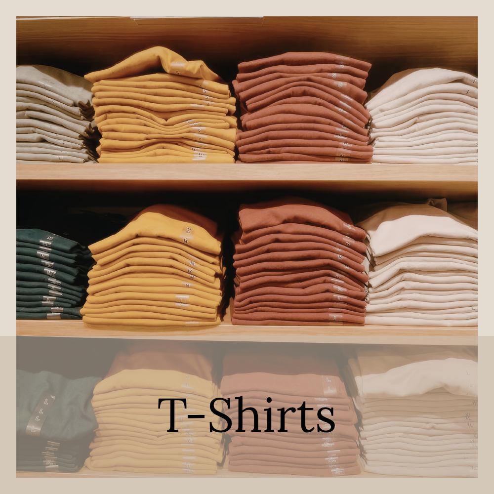 Stacks of shelved tshirts in different colors.