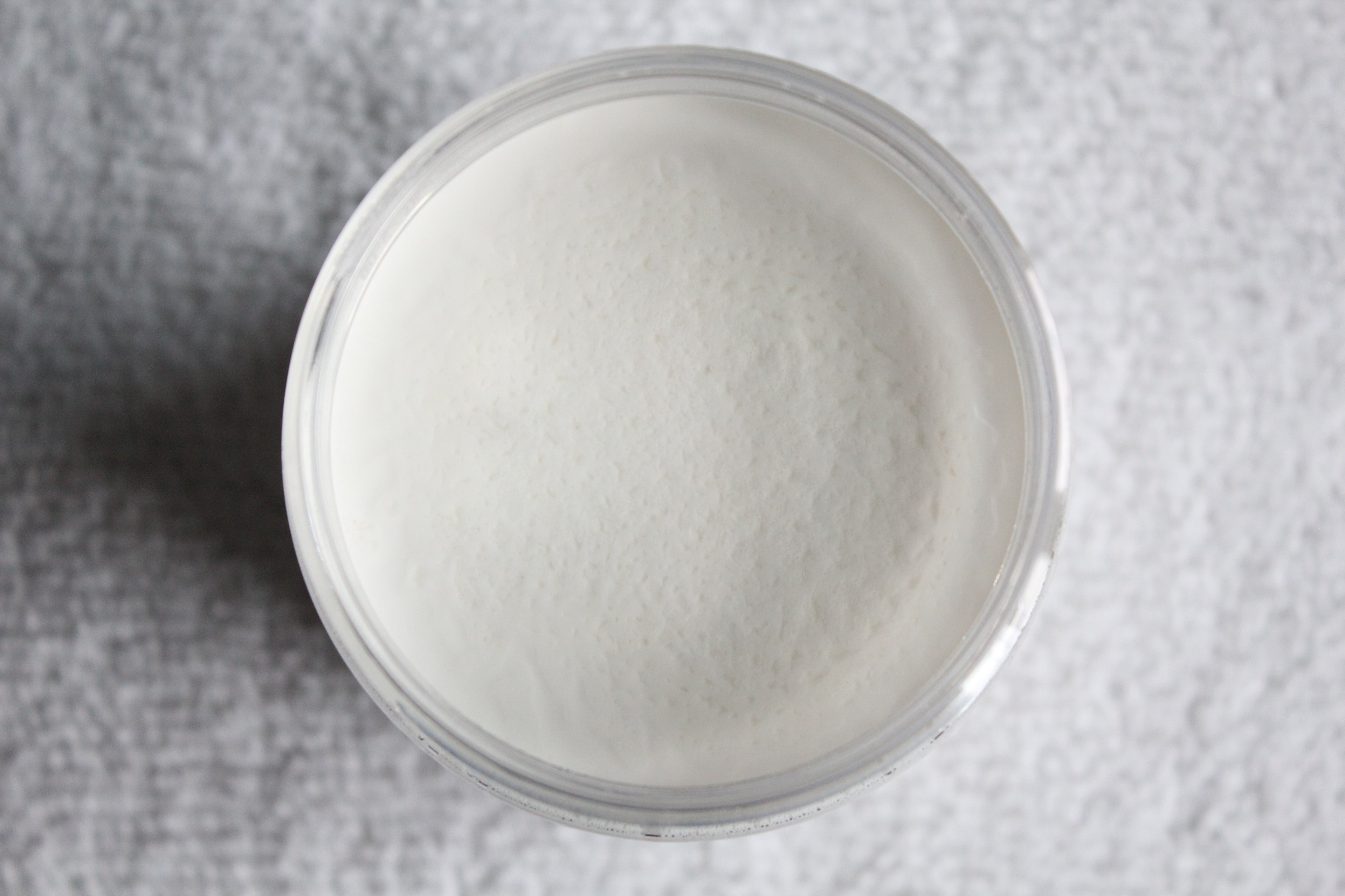 Close up of body butter by Busy Little Body on white table 