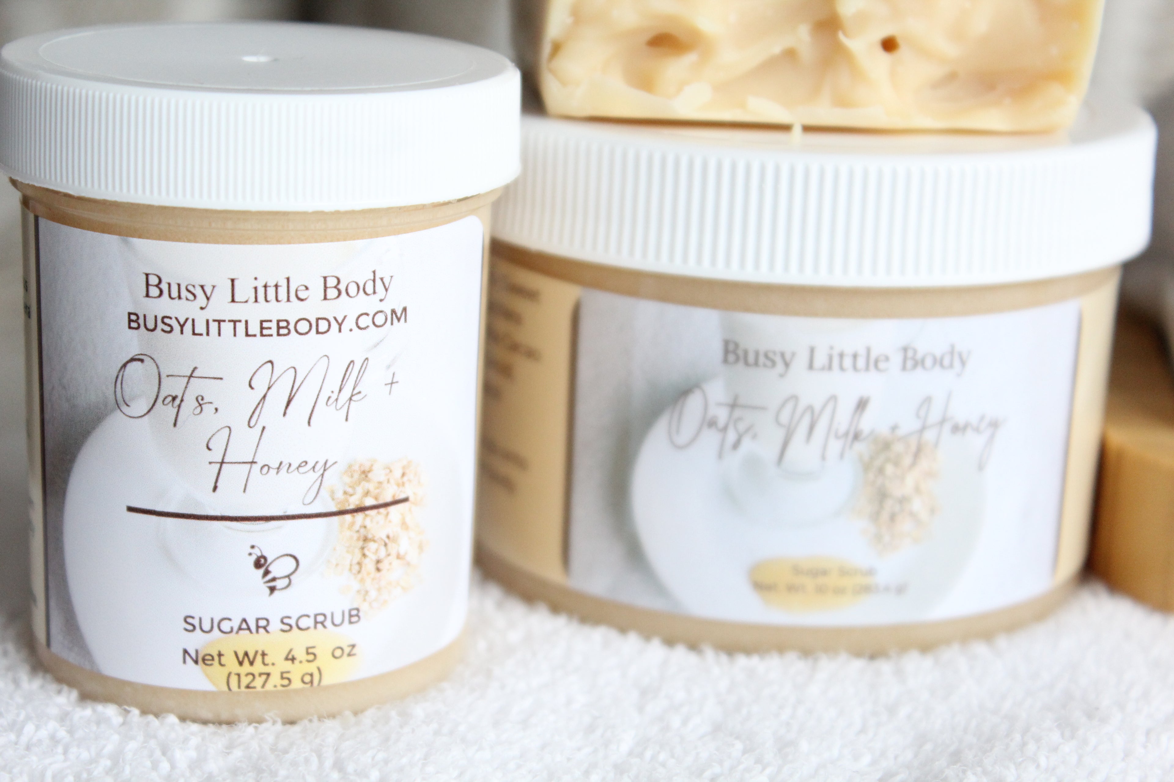 Jar of Busy Little Body Oats & Milk Honey Sugar Scrub on a white background