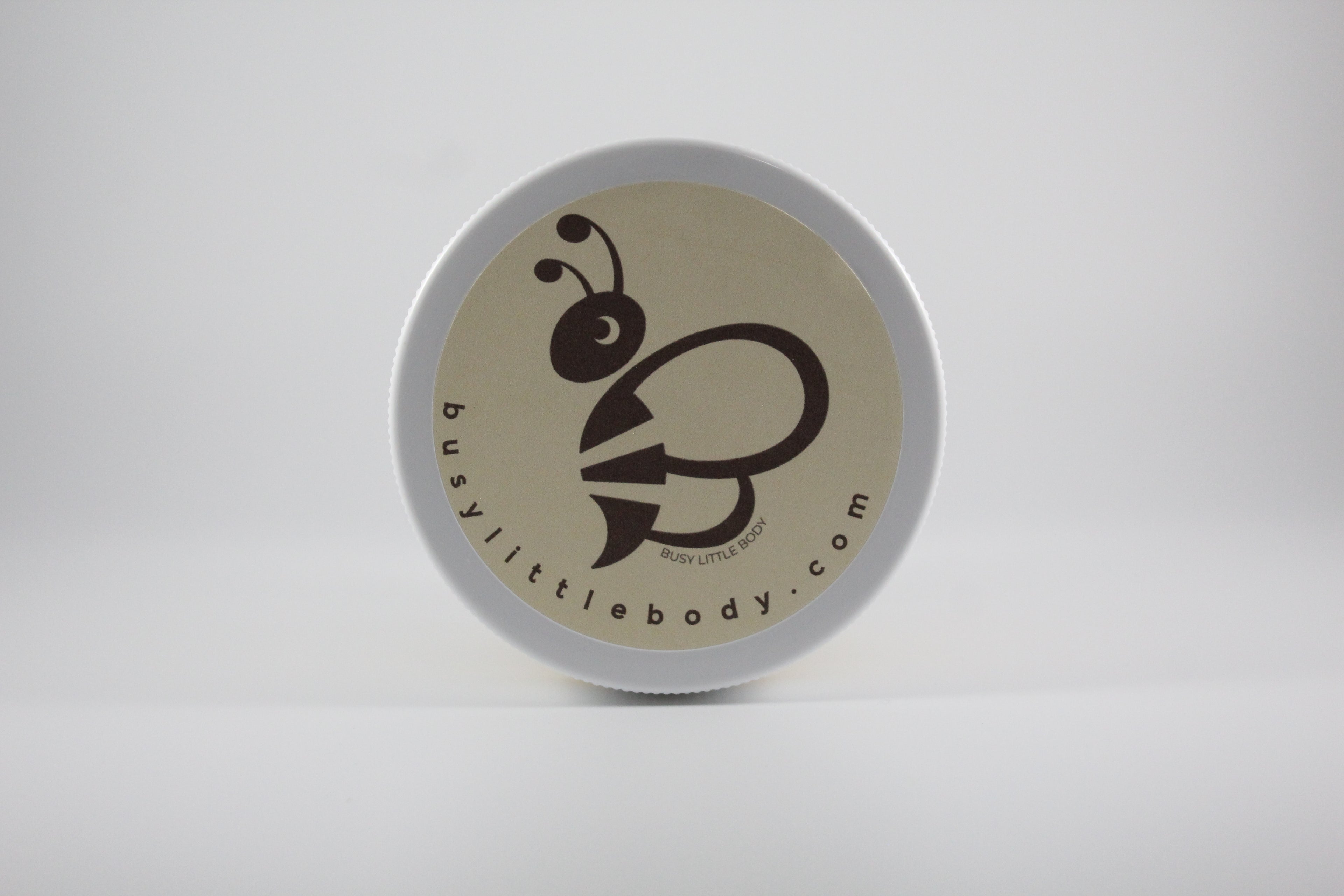 Round container with a bee logo and text on a white background