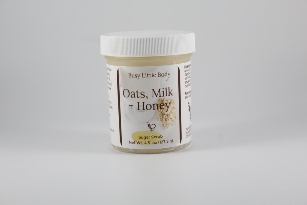 Jar of 'Oats, Milk + Honey' body butter on a gray background