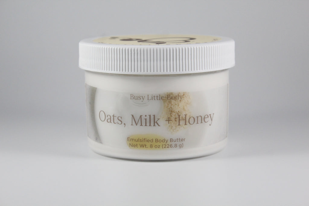 Jar of 'Oats, Milk + Honey' emulsified body butter on a gray background