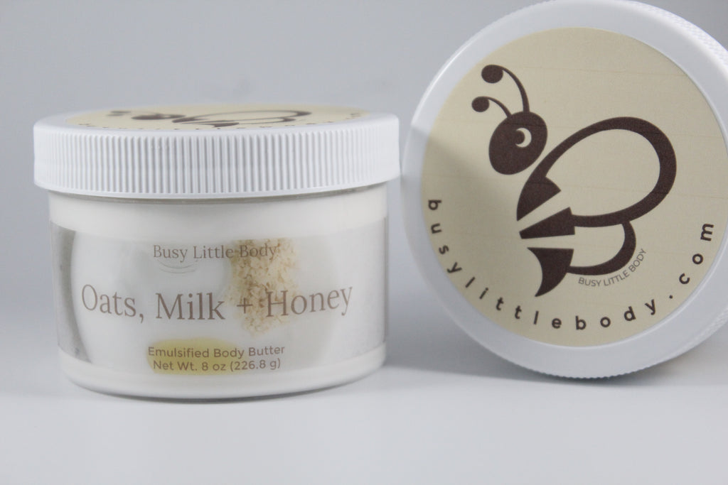 Body butter jar with lid featuring 'Busy Little Body' branding on a gray background