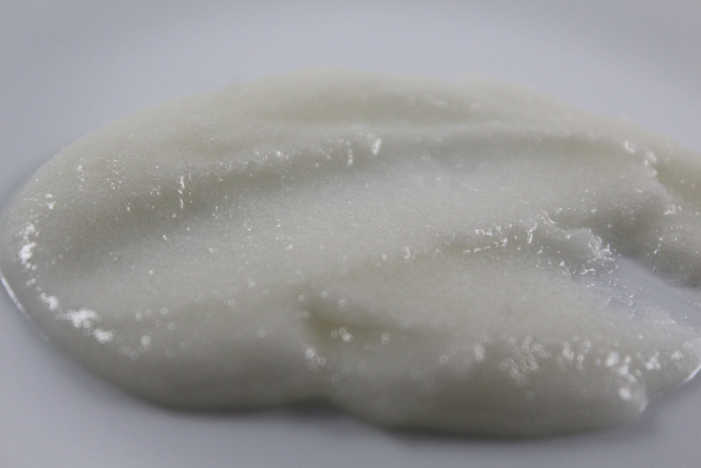 Close up of sugar scrub texture on a white background
