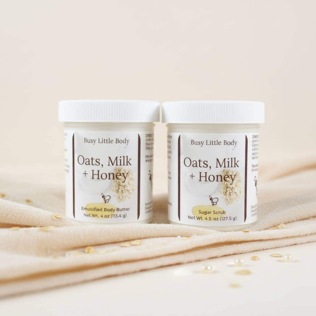 Two jars of 'Oats, Milk + Honey' body products on a soft surface with a light background.
